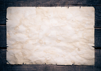 Vintage background with old paper on wooden background