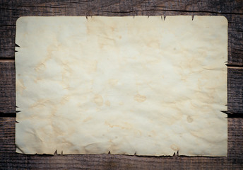 Vintage background with old paper on wooden background
