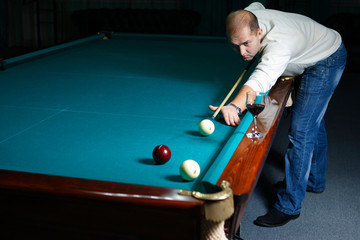 Young man playing snooker