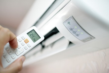 air conditioning on the wall with the set temperature in the room