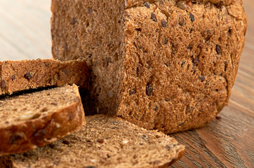 Slices of brown bread on a wooden table
