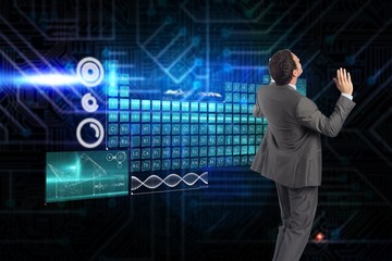 Composite image of businessman posing with arms raised