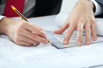 Naklejka premium Architect drawing a construction project