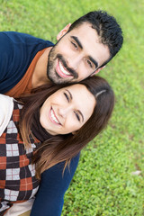 Couple lying in grass