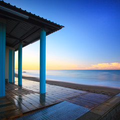 Beach bathhouse colonnade architecture, sea on morning. Tuscany