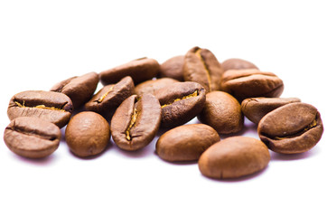 Brown coffee beans isolated on white background