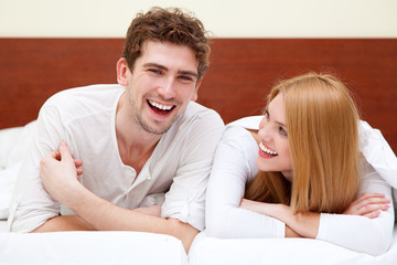 Fototapeta premium Young couple in bed