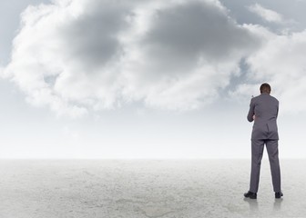 Obraz premium Composite image of thinking businessman holding glasses