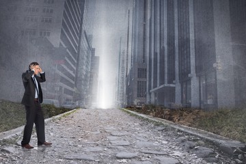 Composite image of stressed businessman with hands on head