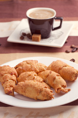 Coffee served with croissant
