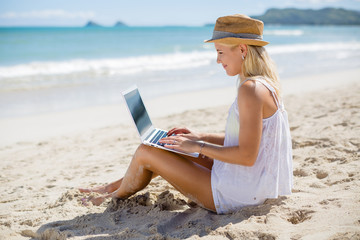 Caucasian business woman on beach