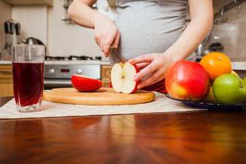 beautiful pregnant woman on kitchen