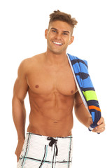 man swimsuit with towel over shoulder