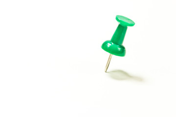 Push pin on white background
