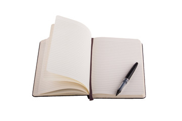 Fountain pen placed on notebook, isolated on white background.