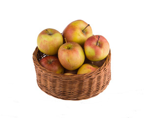 Basket with apples isolated on white background.