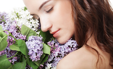 Naklejka premium spring girl with lilac flowers.