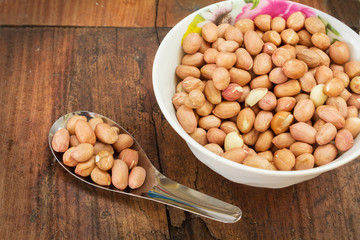 Peanuts in bowl and spoon.