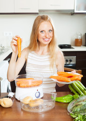 Blonde long-haired housewife cooking vegetables