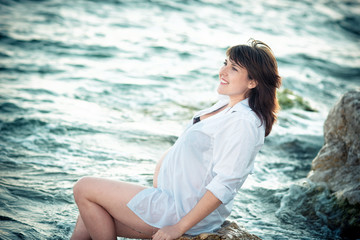 Pregnant woman on the sea