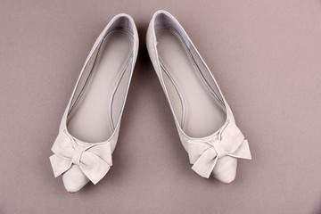 Beautiful female shoes, on grey background