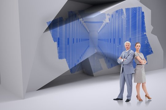 Composite image of serious businessman standing back to back wit - Powered by Adobe