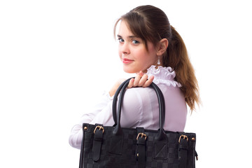 Beautiful cute young girl with a bag behind the back