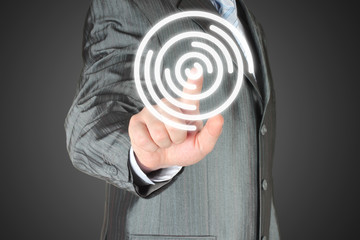 Man pushes icon on dark background