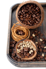 Green coffee and black coffee in bowls of coconut