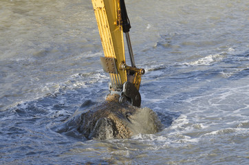 Dredging harbor with excavator
