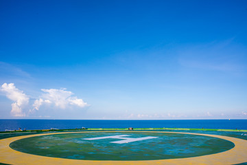Oil rig helipad with blue sky
