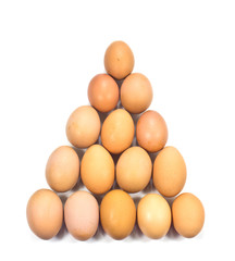 Egg arranged in triangle on white background