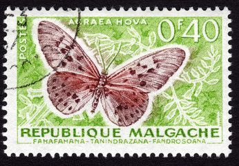 Postage stamp from Madagascar, Malgache in French, showing the e