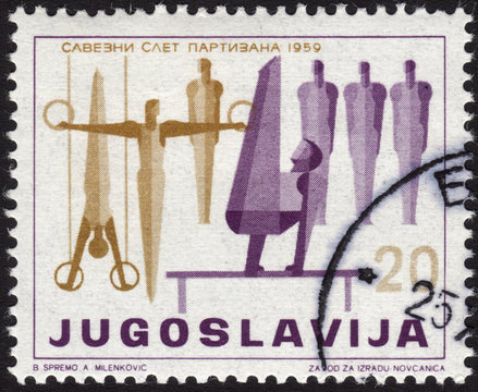 Postage stamp from Yugoslavia ca. 1959 depicting gymnastics