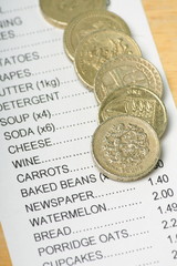 British Pound Coins on a Receipt for Food Shopping