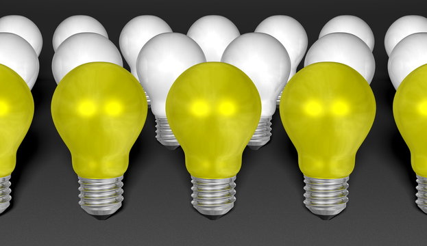 Rows of yellow and white light bulbs on grey background