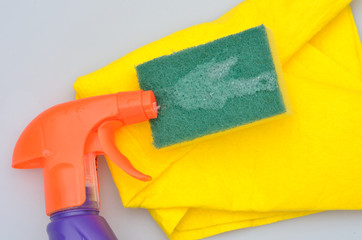 spray bottle over sponge and cloth