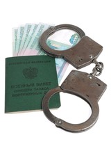 Military card of officer, handcuffs and money isolated