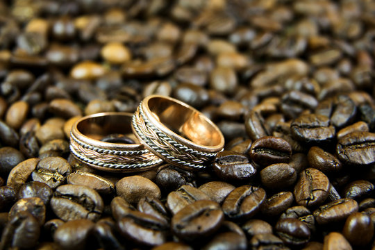 Wedding rings on coffee beans