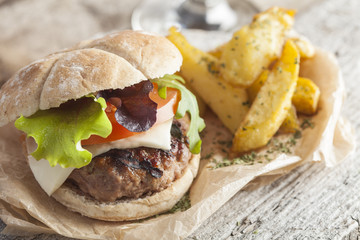 Gourmet delious burger with cheese, tomato and lettuce