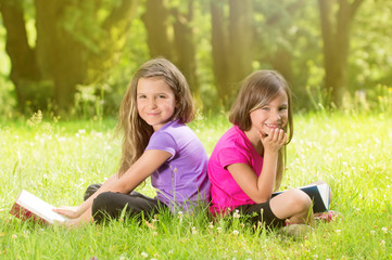 Fototapeta premium Two Girls in glowing sun in the Park