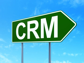Finance concept: CRM on road sign background