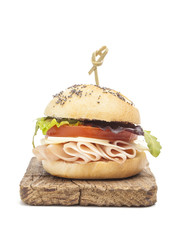 Sandwich with ham, tomato, lettuce and cheese