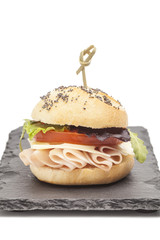 Sandwich with ham, tomato, lettuce and cheese