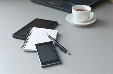 Laptop, tablet and cup of tea