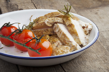 Fried chicken with cherry tomatoes