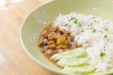 Chicken with sauce over rice