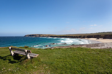 Fototapeta na wymiar Empty bench overlooking a scottish atlantic beach
