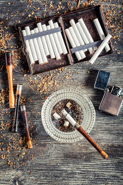 Cigarettes, ashtray and a smoking pipe