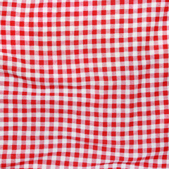 Texture of a red and white checkered picnic blanket.